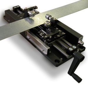 Continuous strip width gauge